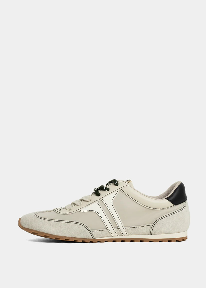 White retro sneaker with black accents on a light gray background